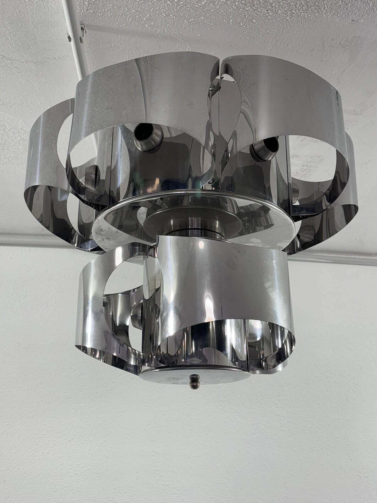 Curved steel chandelier attributed to Max Sauze, 9 lights