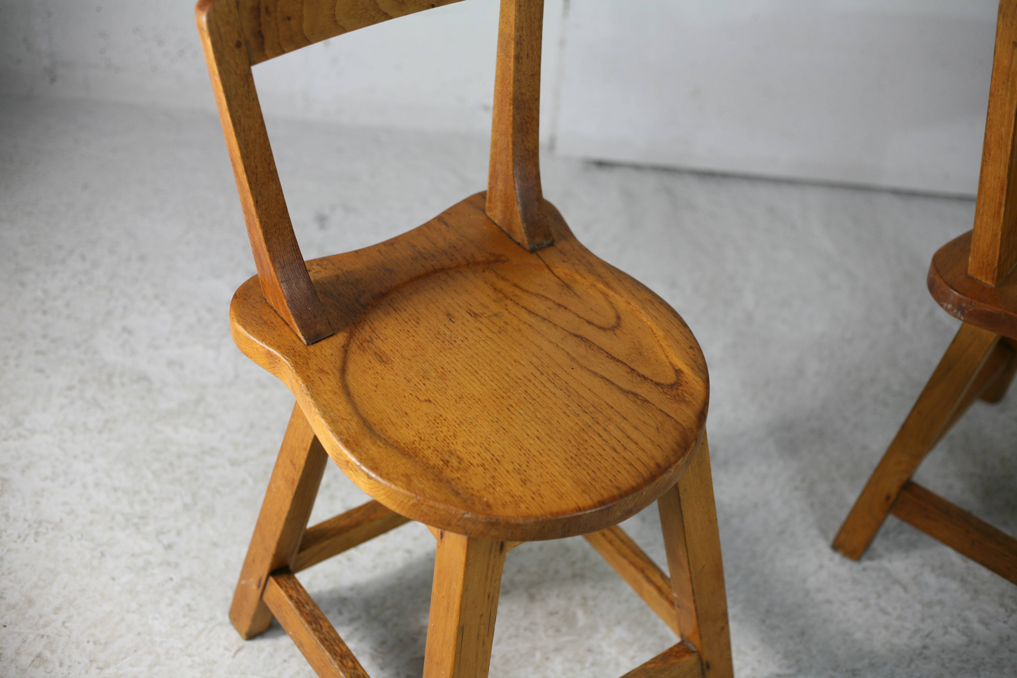 Pair of brutalist wooden back stools. France, circa 1960