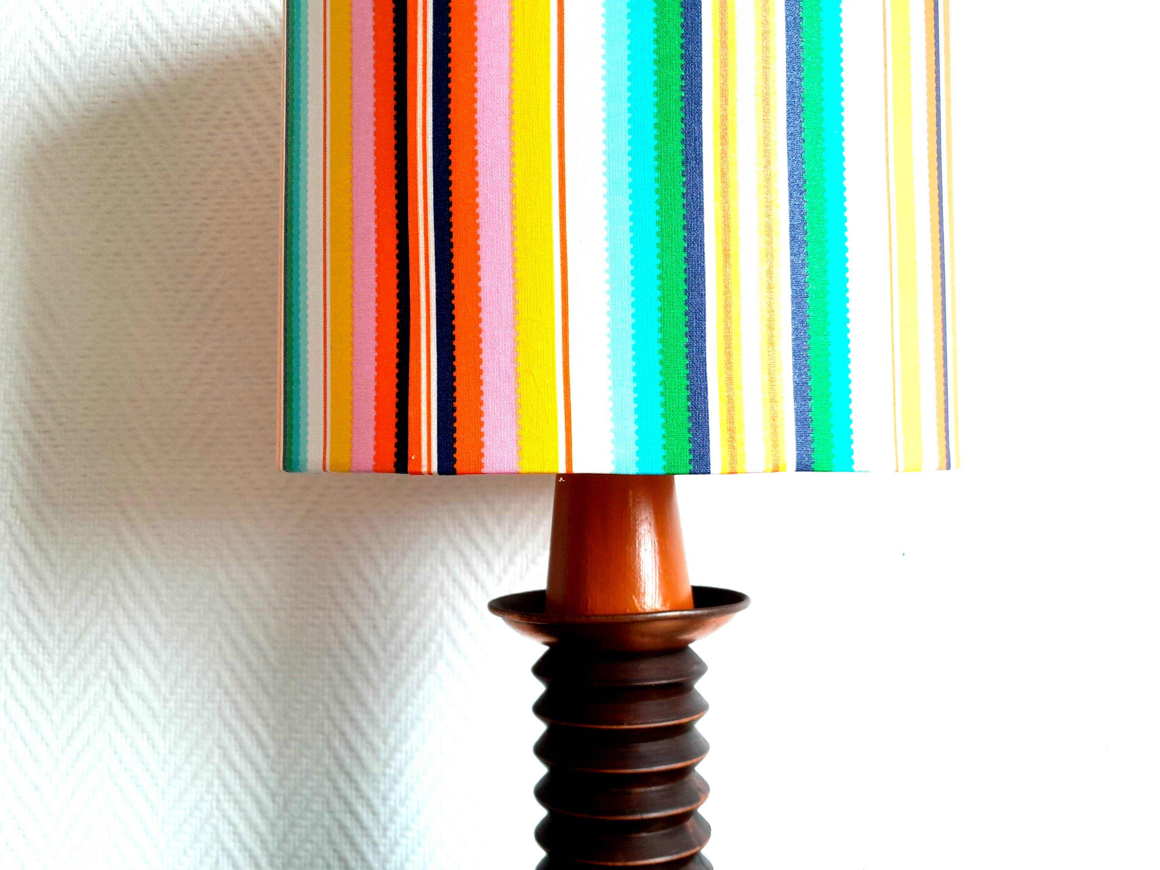 Wooden lamp with striped lampshade