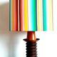 Wooden lamp with striped lampshade