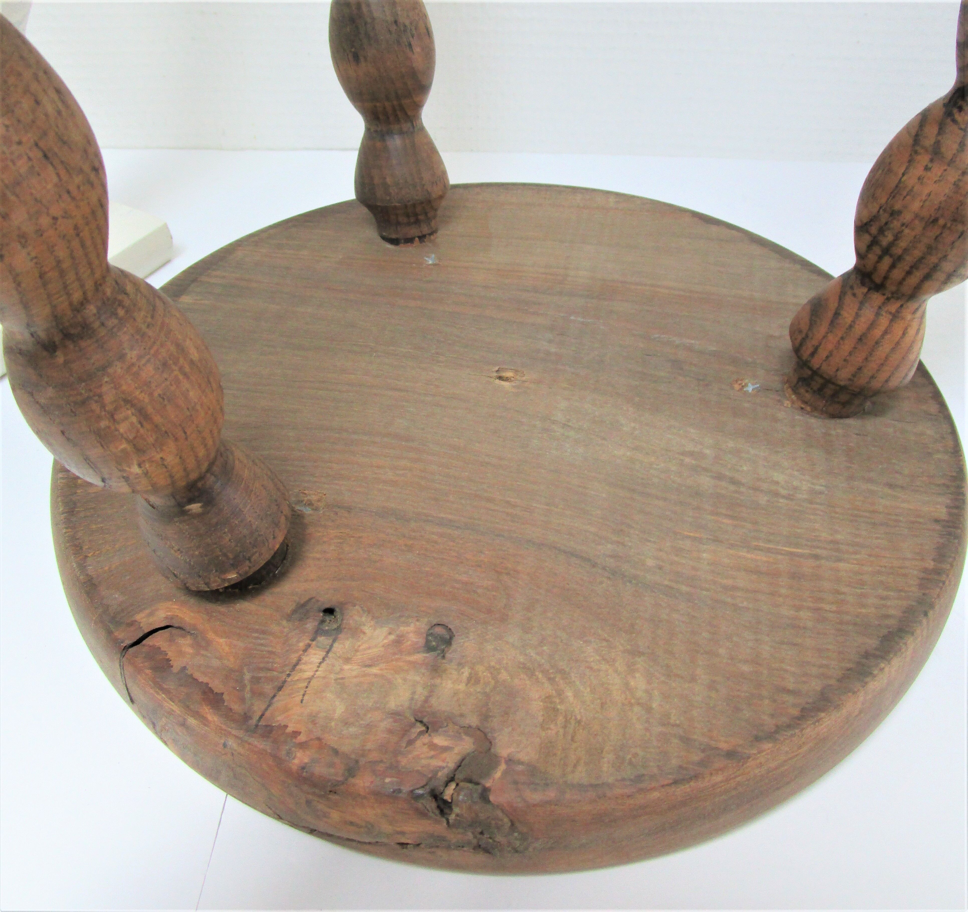 Two vintage tripod solid wood stools