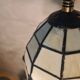 pair of bedside lamps in gilded bronze with glass shade
