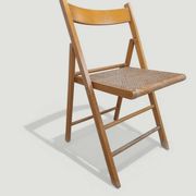 Vintage folding chair with caning.