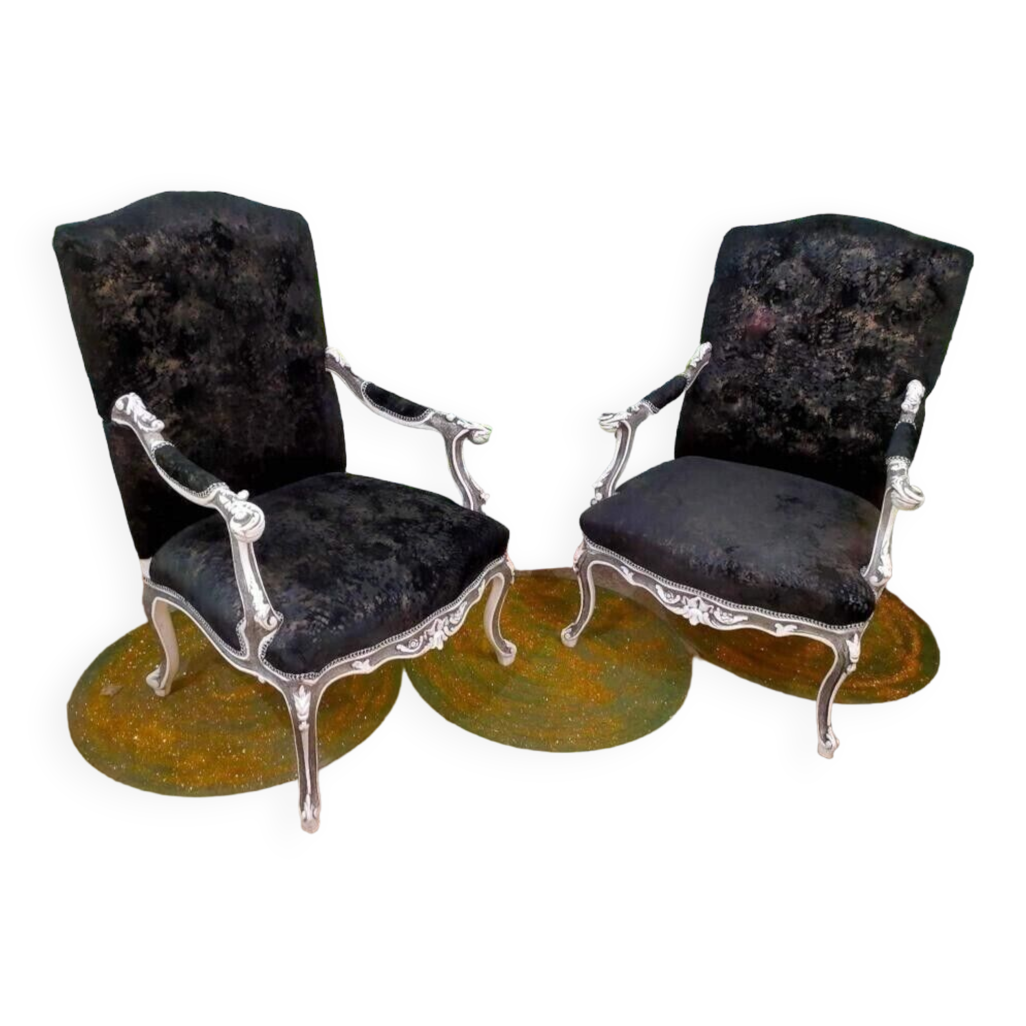 Black Louis XV style armchairs