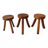 3 wooden tripod stools