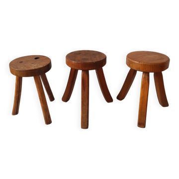 3 wooden tripod stools