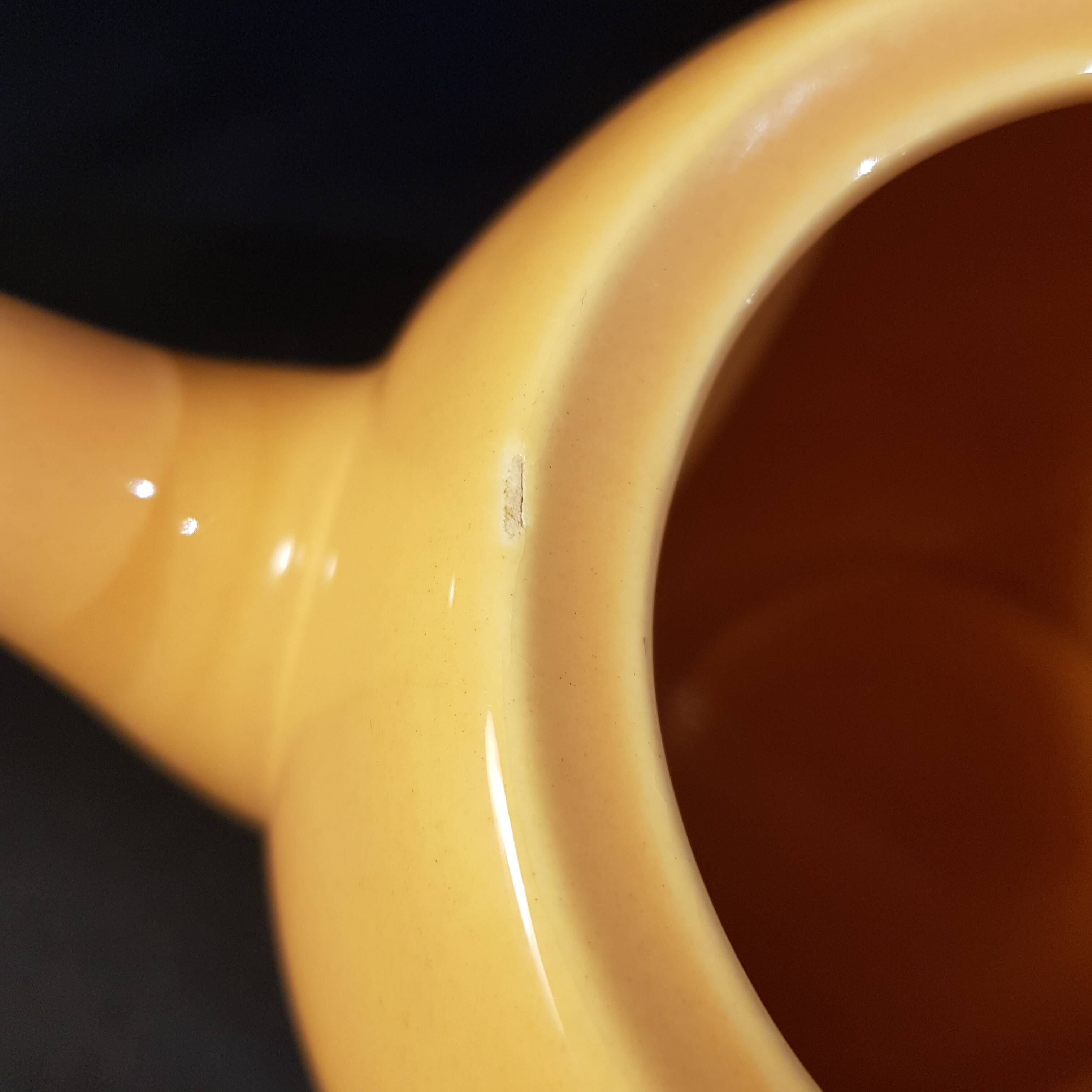 Yellow ceramic teapot