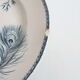 Old dish of opaque porcelain on ground transfer service