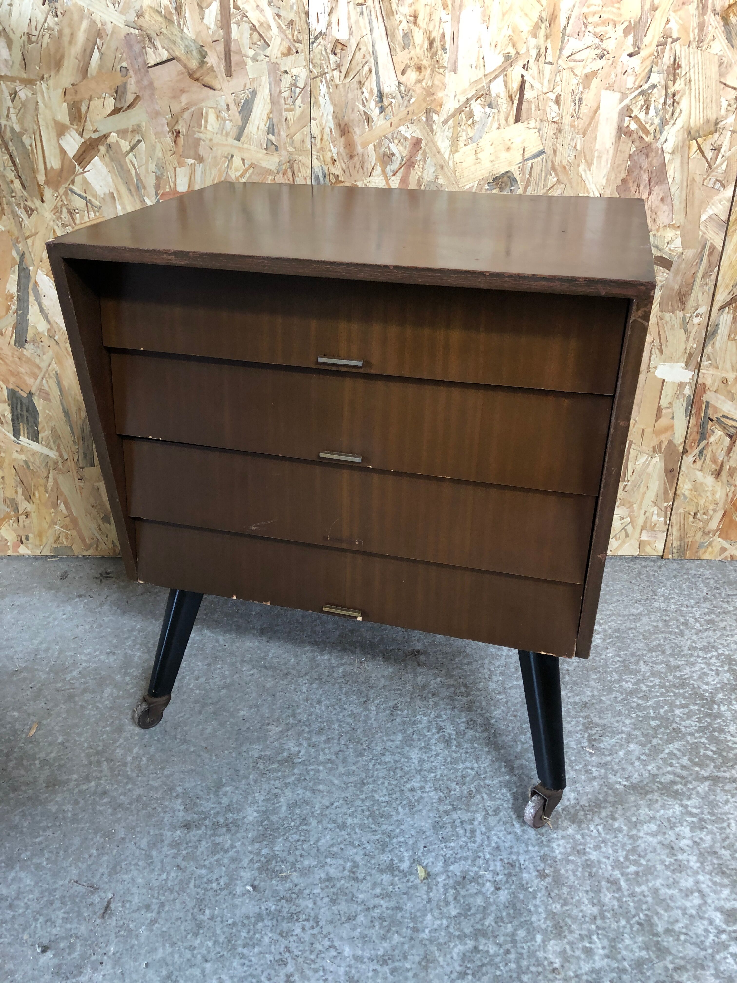 Old chest of drawers 4 drawers wood feet compass black + castors 70s vintage