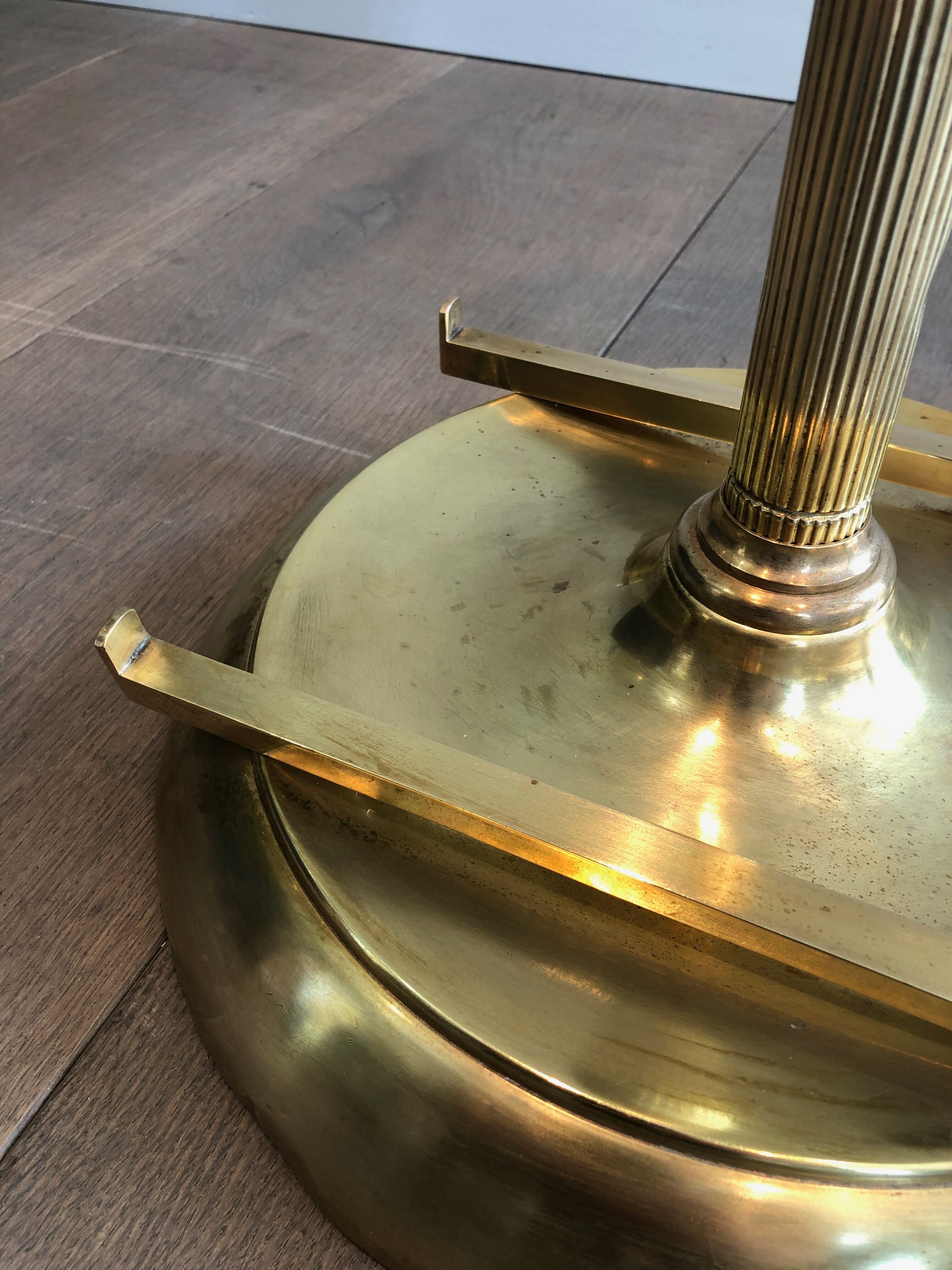 Neoclassical style valet stand in brass and black lacquered wood. French work. Circa 1940