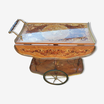 Cart rolling from serving table to marquetry
