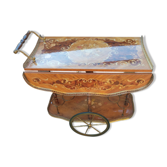 Cart rolling from serving table to marquetry