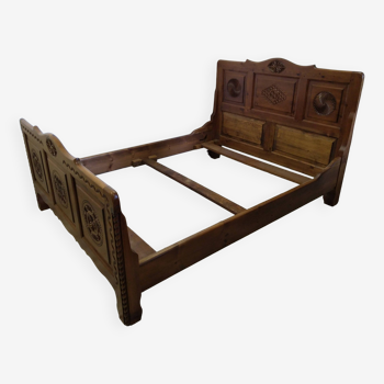 Carved wooden bed