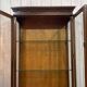 English display cabinet with two sections made of yew from the 1980s.