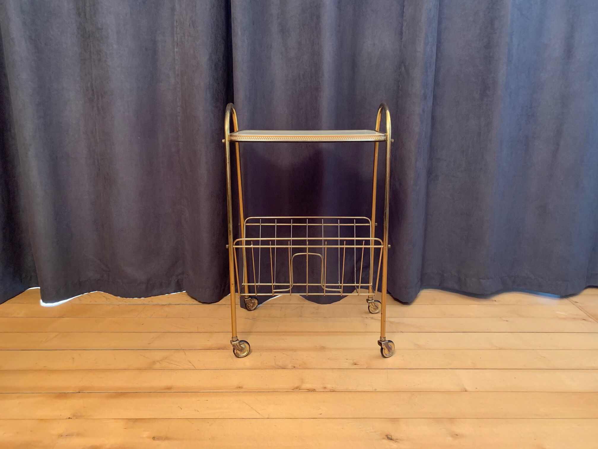 Mobile newspaper holder, 1960s