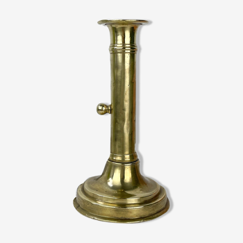 Brass candle holder with pusher late nineteenth century
