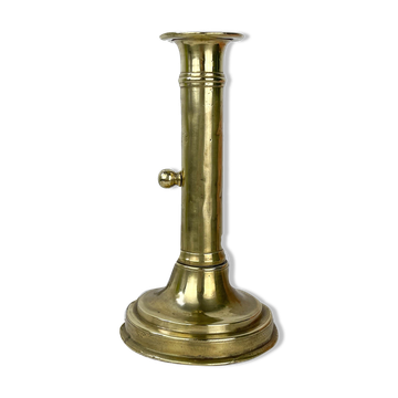 Brass candle holder with push button, late 19th century
