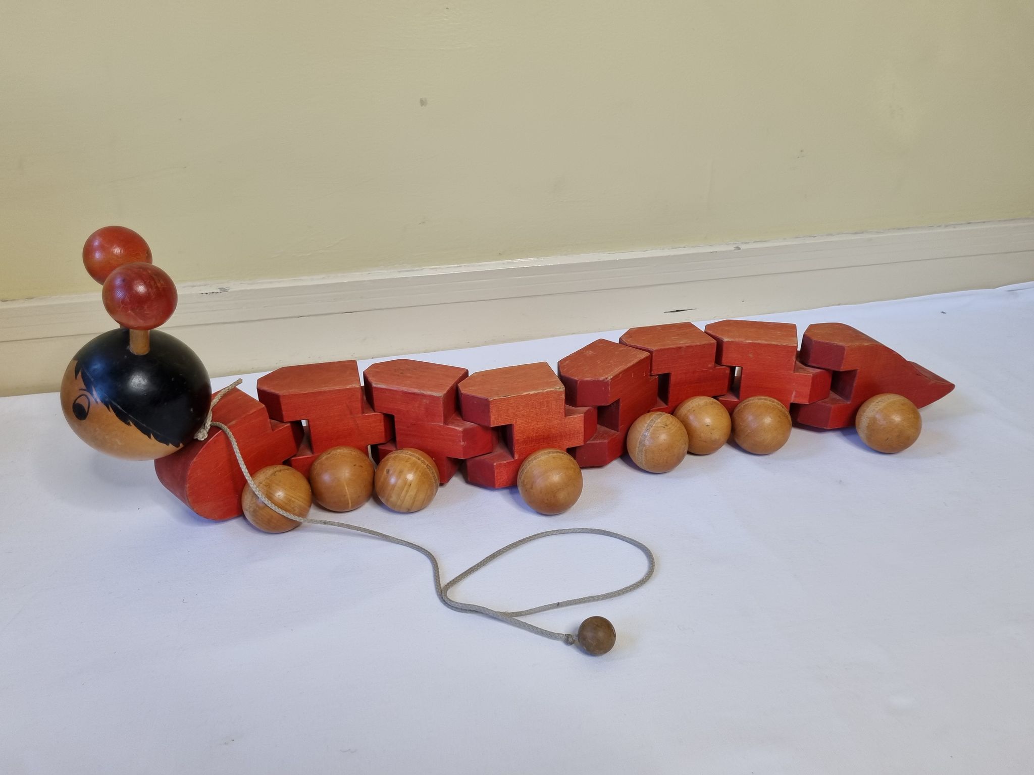 Vintage pulling toy, "centipede", 82 cm, made in Switzerland