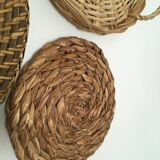 Wall composition of seven baskets and wicker trays