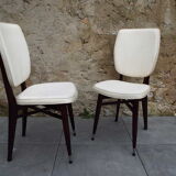 2 skai and wooden chairs