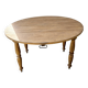 Round oak table with a drop leaf.