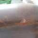 Paire de fauteuils club en cuir marron