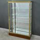 Brass display cabinet with a mirrored back – early 20th century