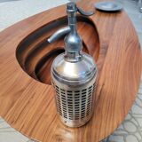 Seltzer water siphon in its protective grid