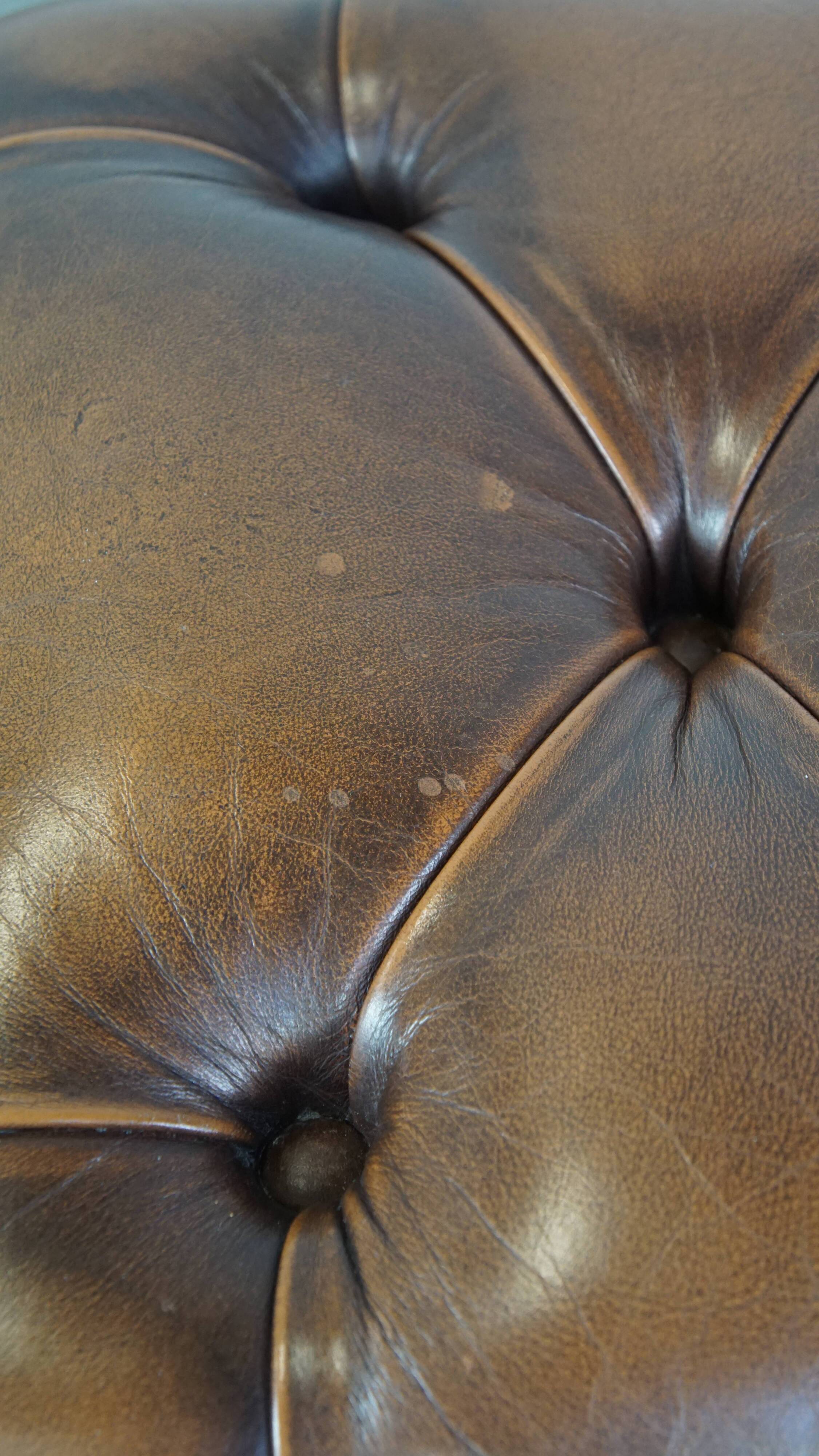 Brown cow leather chesterfield footstool