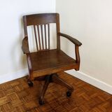 Oak wood office chair with swivel seat and swivel wheels