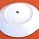 Serving dish with handles, fine Bohemian porcelain with floral decoration on a background.