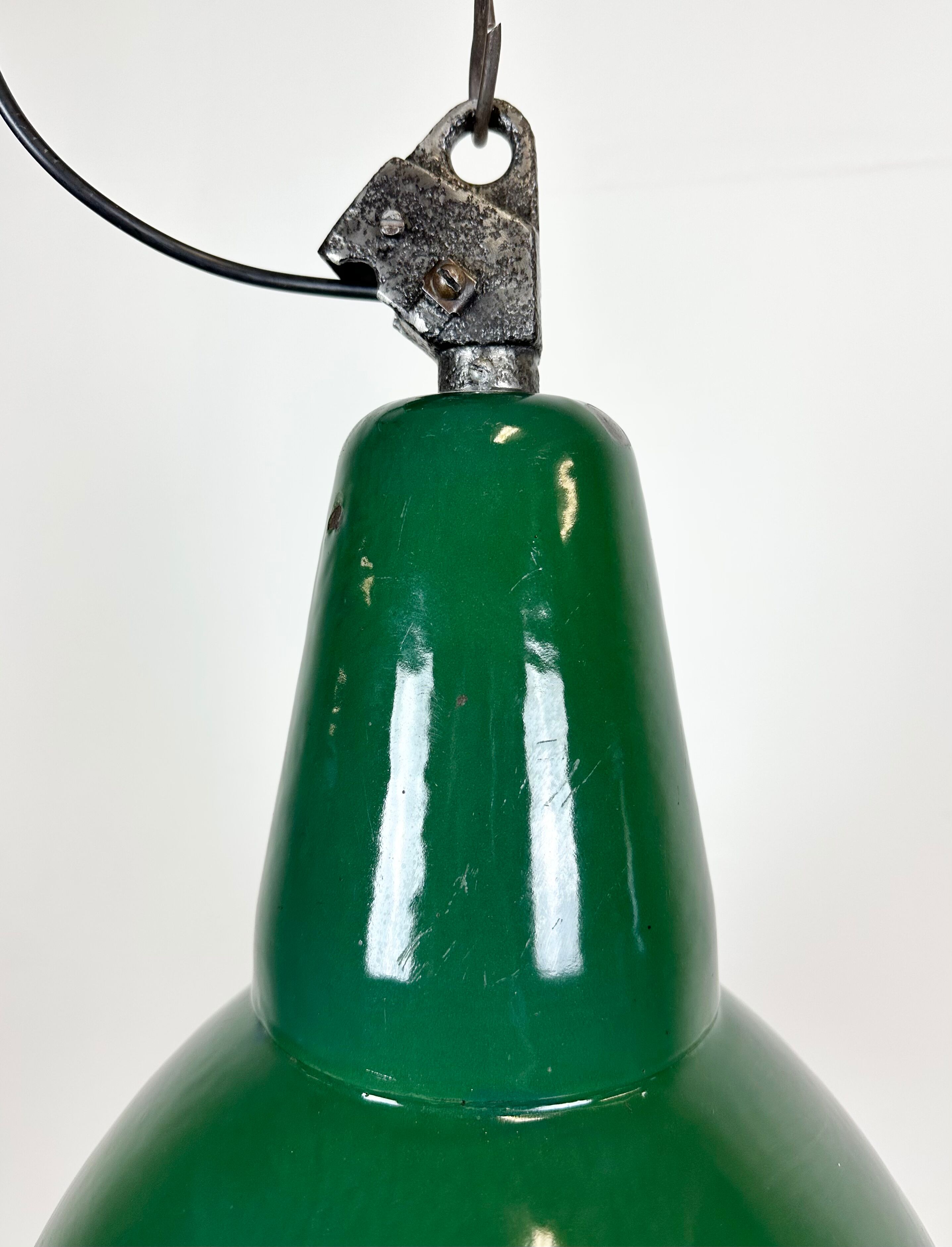 Industrial green enamel factory lamp with cast iron top, 1960s