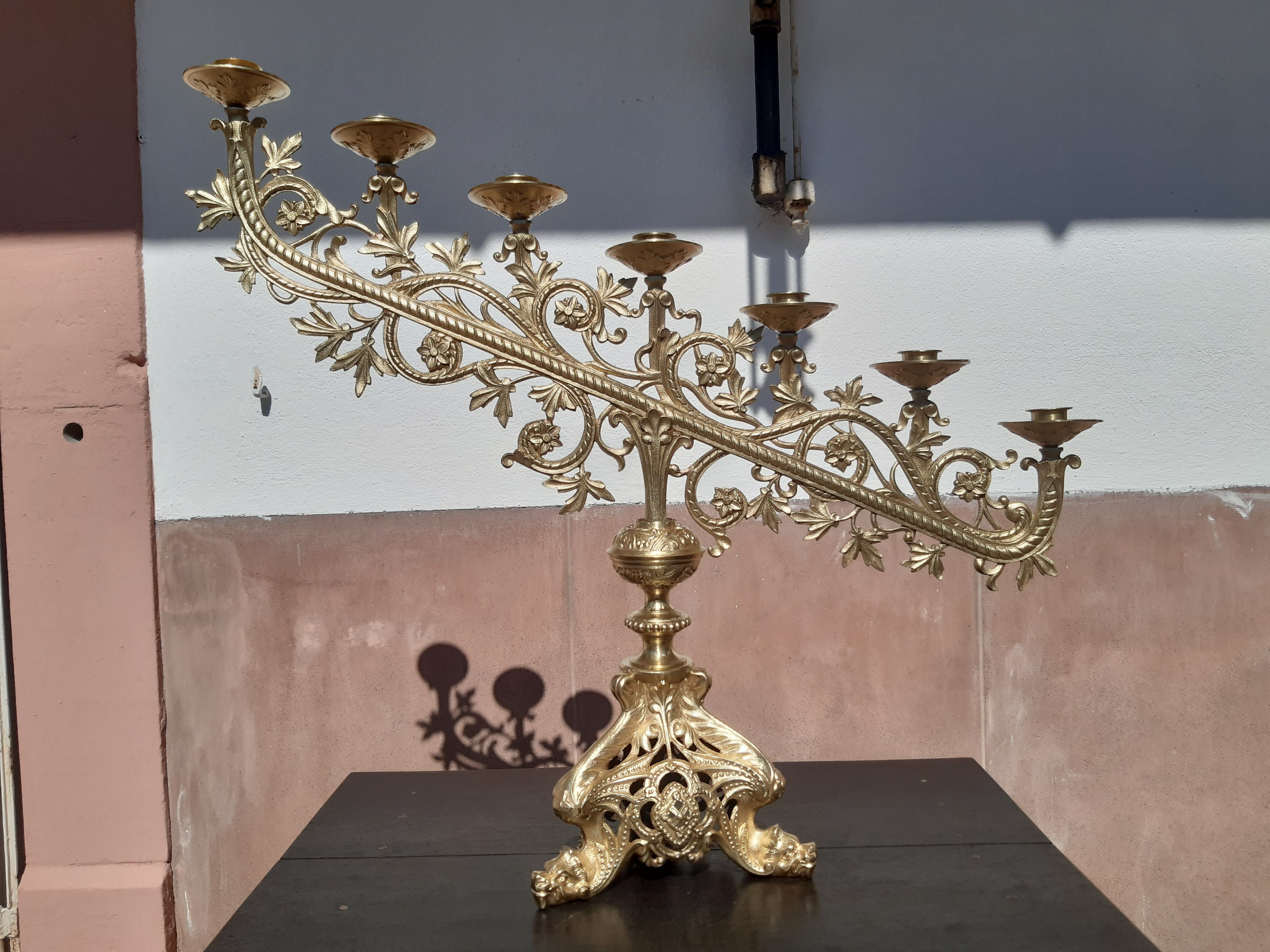 Antique candle holder in bronze and brass nineteenth century.