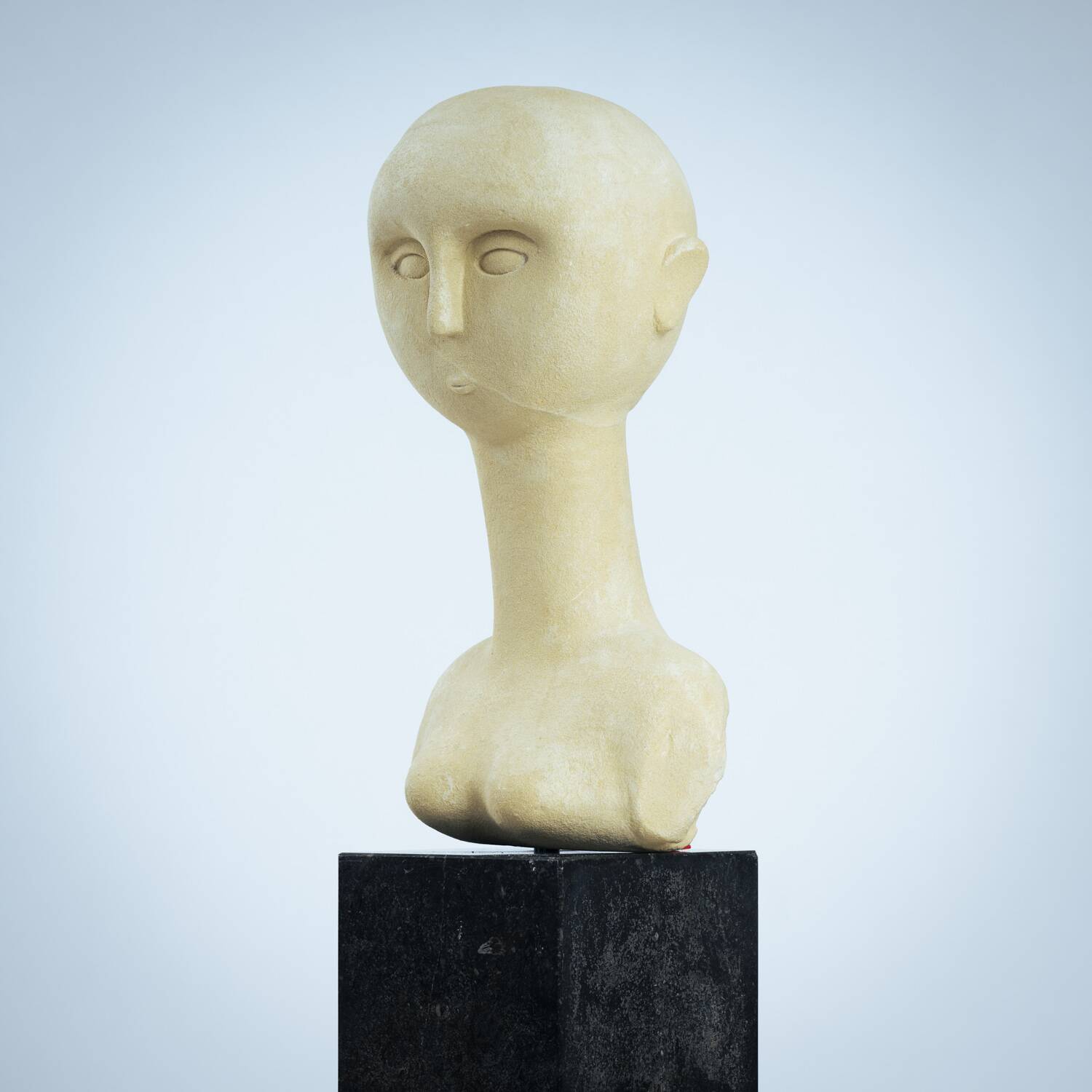 Modernist bust sculpture of a woman in sandstone