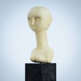 Modernist bust sculpture of a woman in sandstone