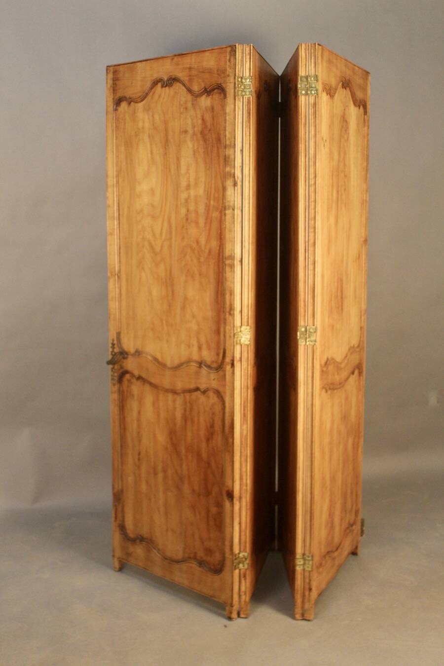 Large cherry wood folding screen with four double-sided panels.