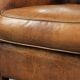 Comfortable characterful sheepskin armchair finished with decorative nails