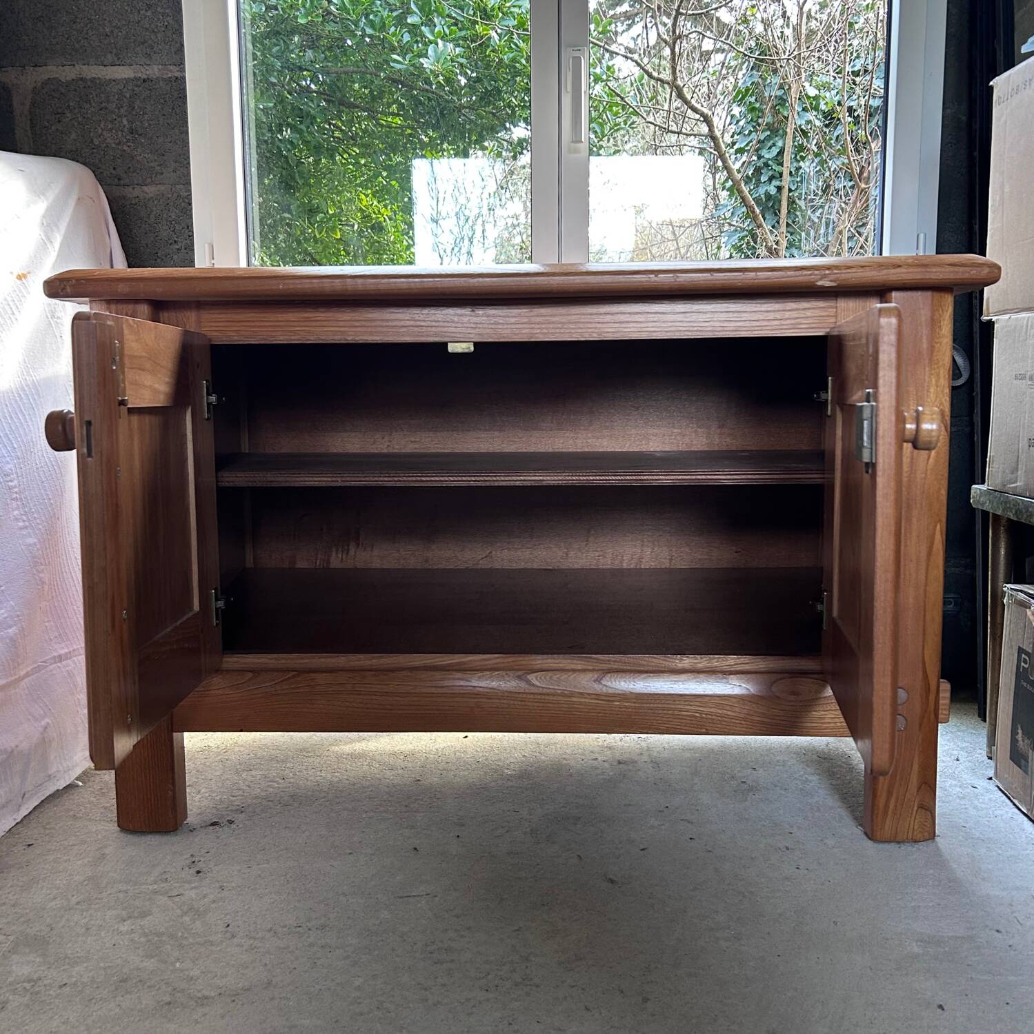 Small varnished wooden buffet