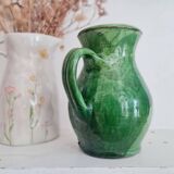 Antique green pitcher in painted terracotta