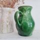 Antique green pitcher in painted terracotta