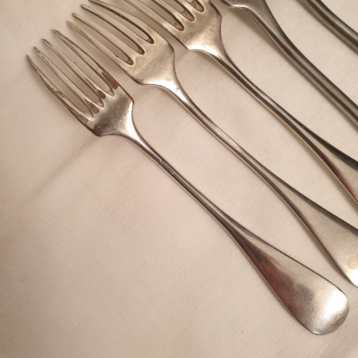 10 mismatched silver metal forks