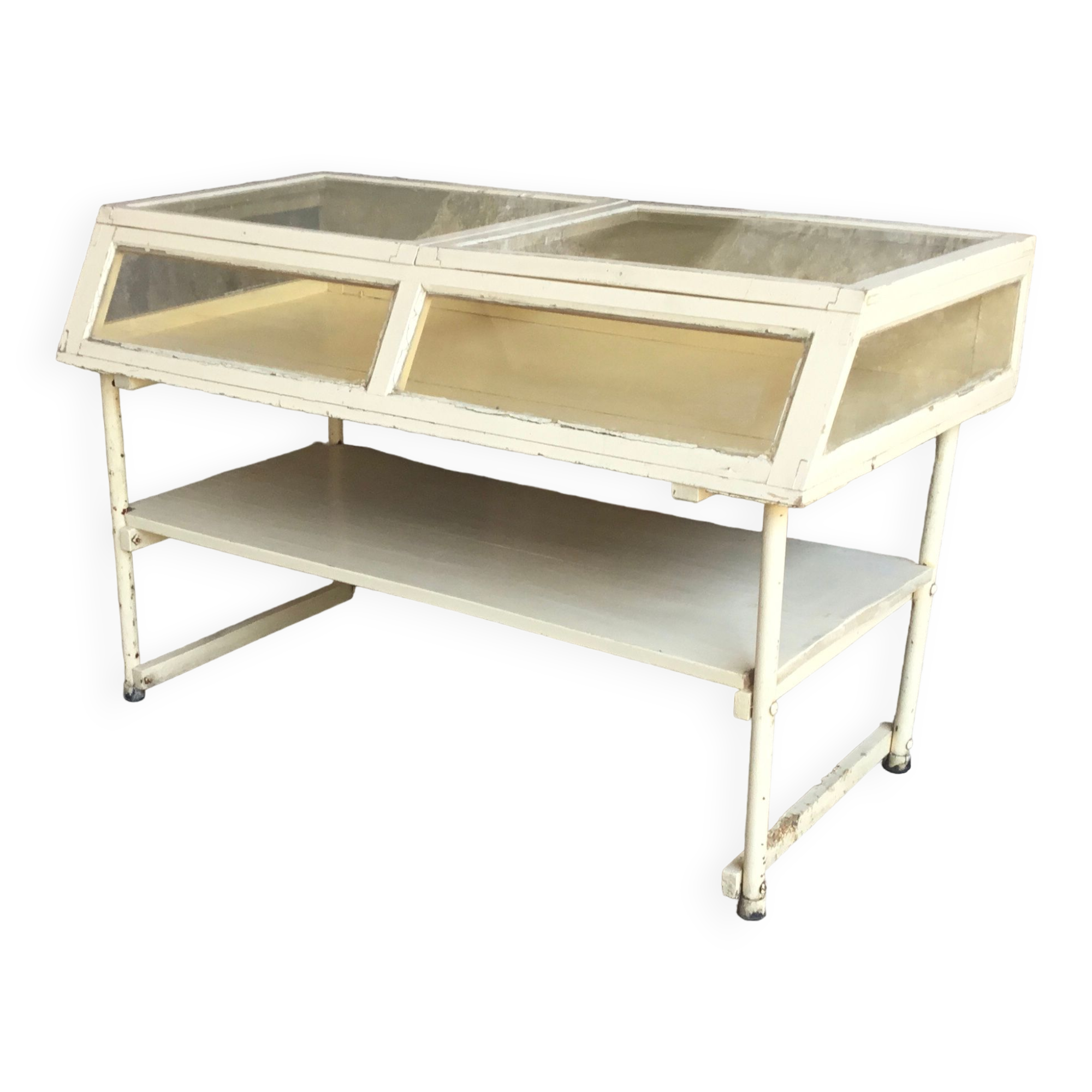 Old showcase on tubular metal feet - early twentieth century
