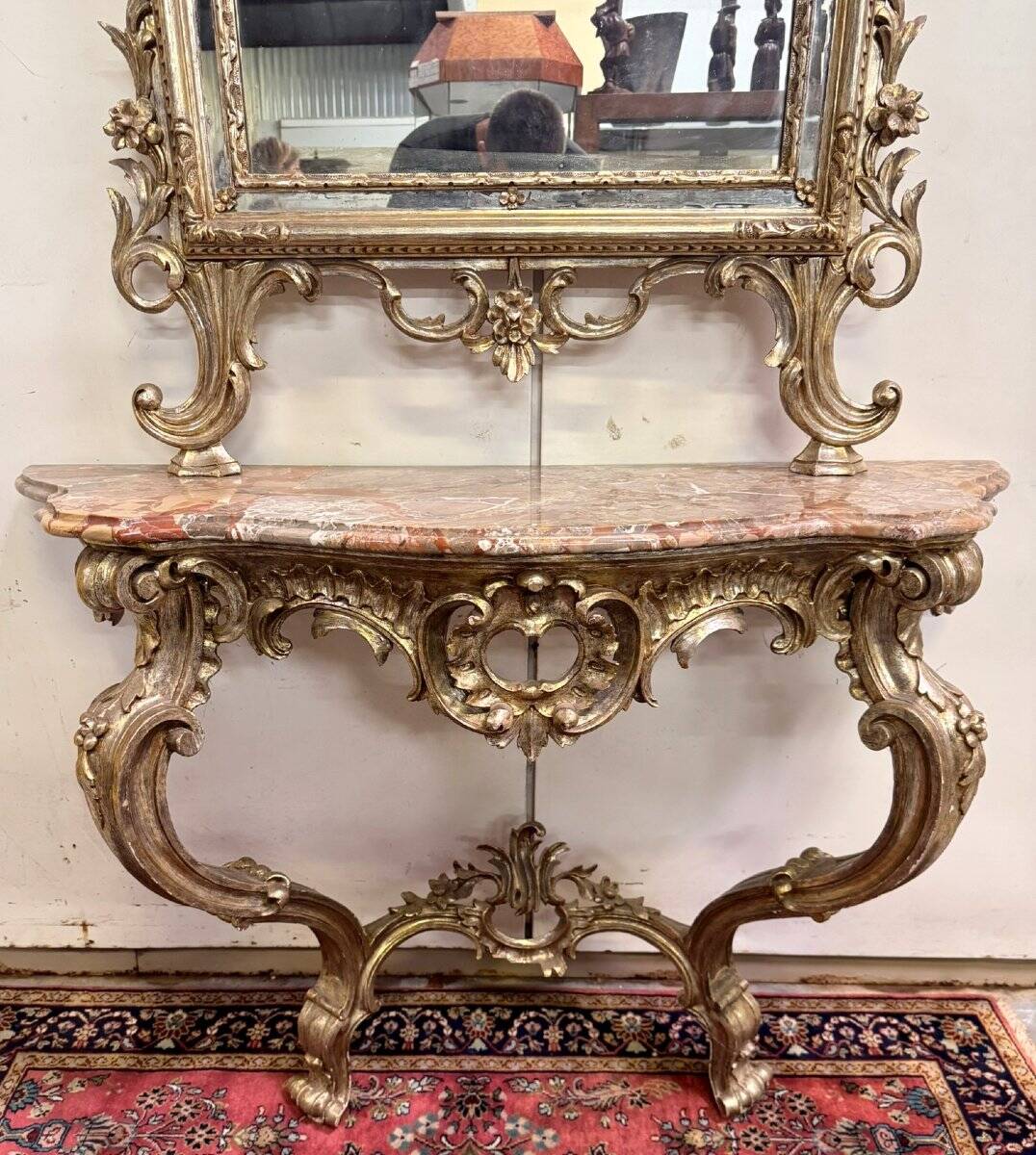 Important console table with a curved shape + Louis XV style mirror in gilded and silvered wood.
