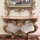 Important console table with a curved shape + Louis XV style mirror in gilded and silvered wood.