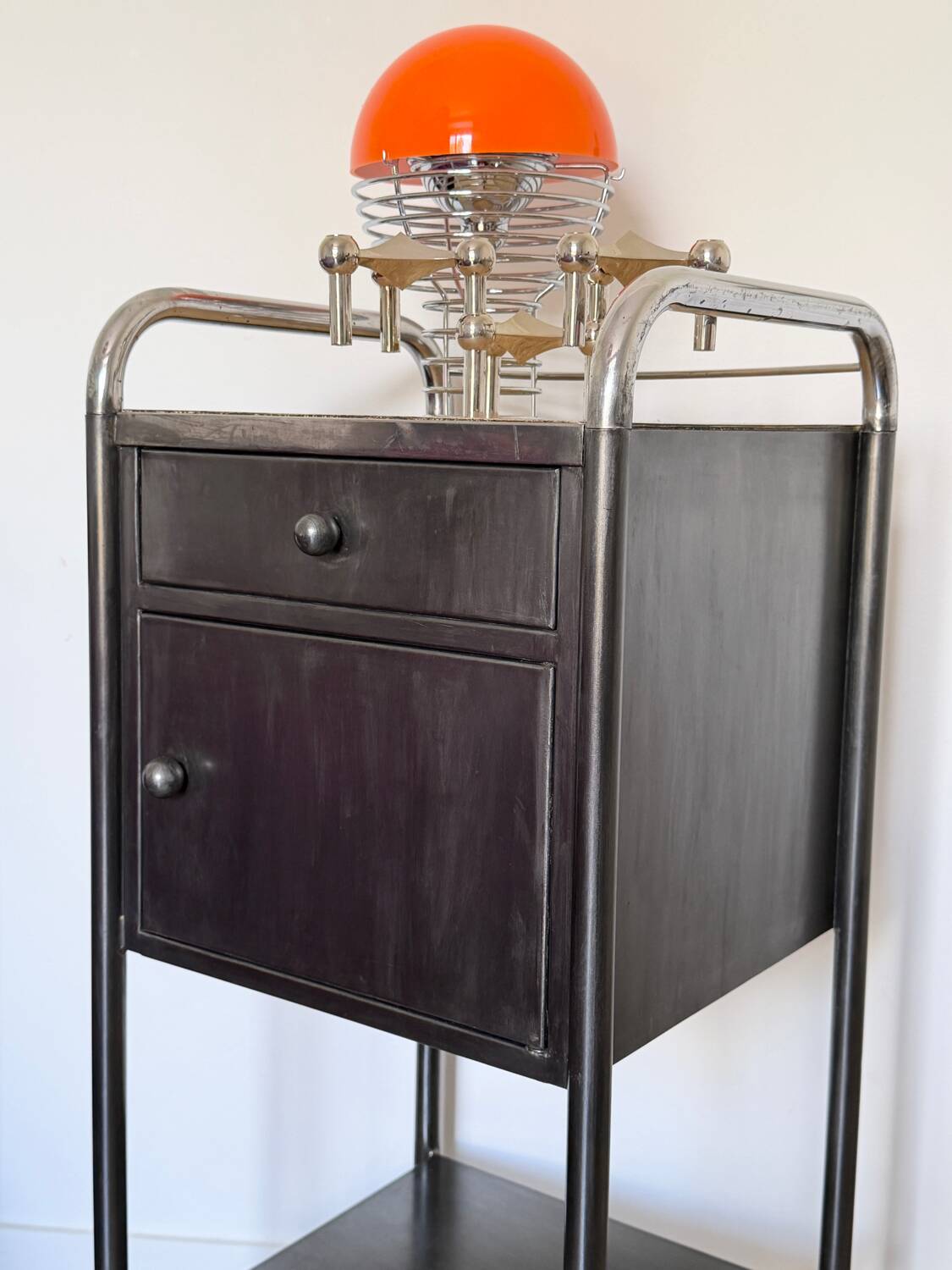 Vintage bedside table in brushed metal