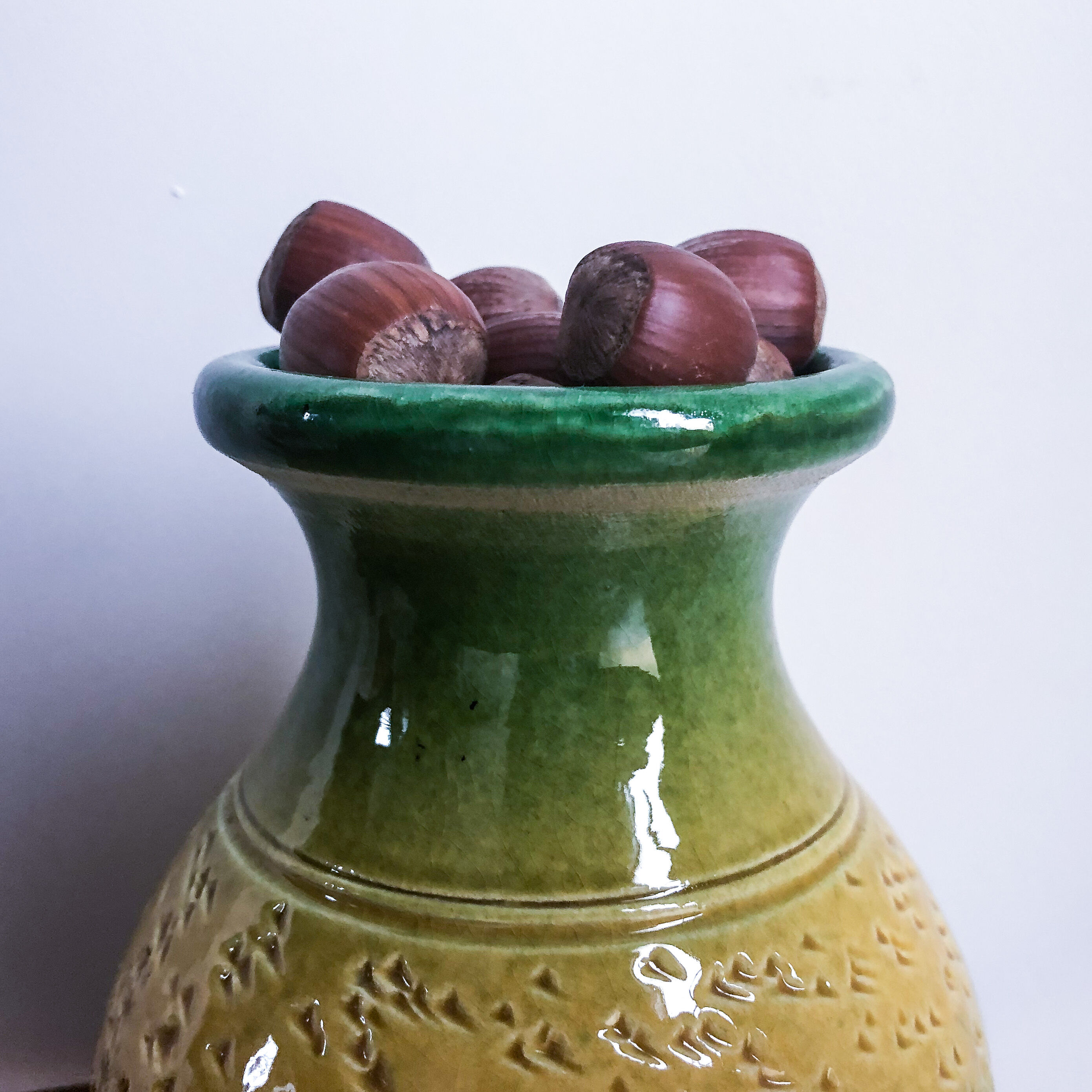 Yellow and green enamelled terracotta vase