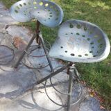 Two tractor-style industrial stools