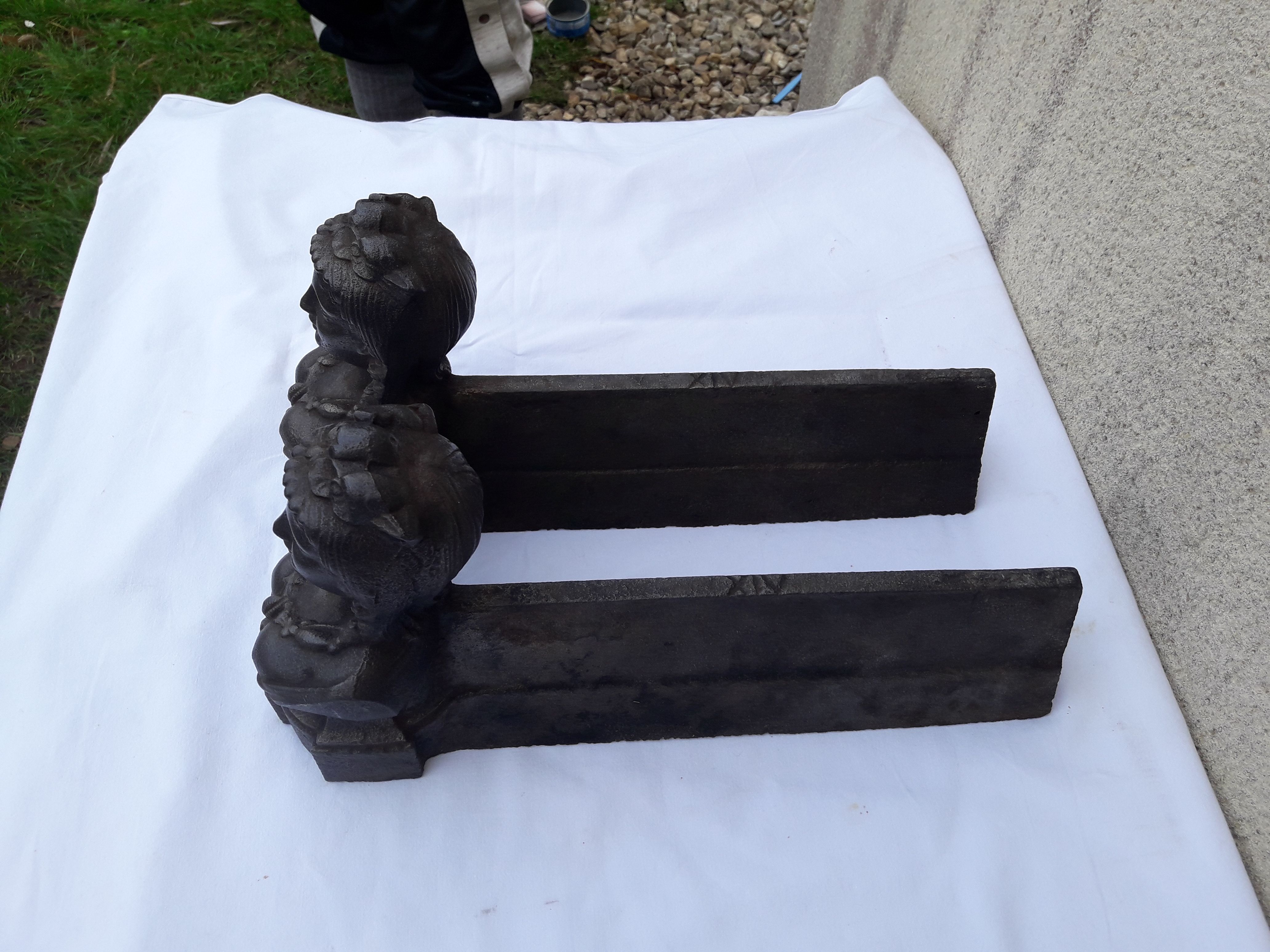 Pair of cast iron channels and metal FAU woman's head