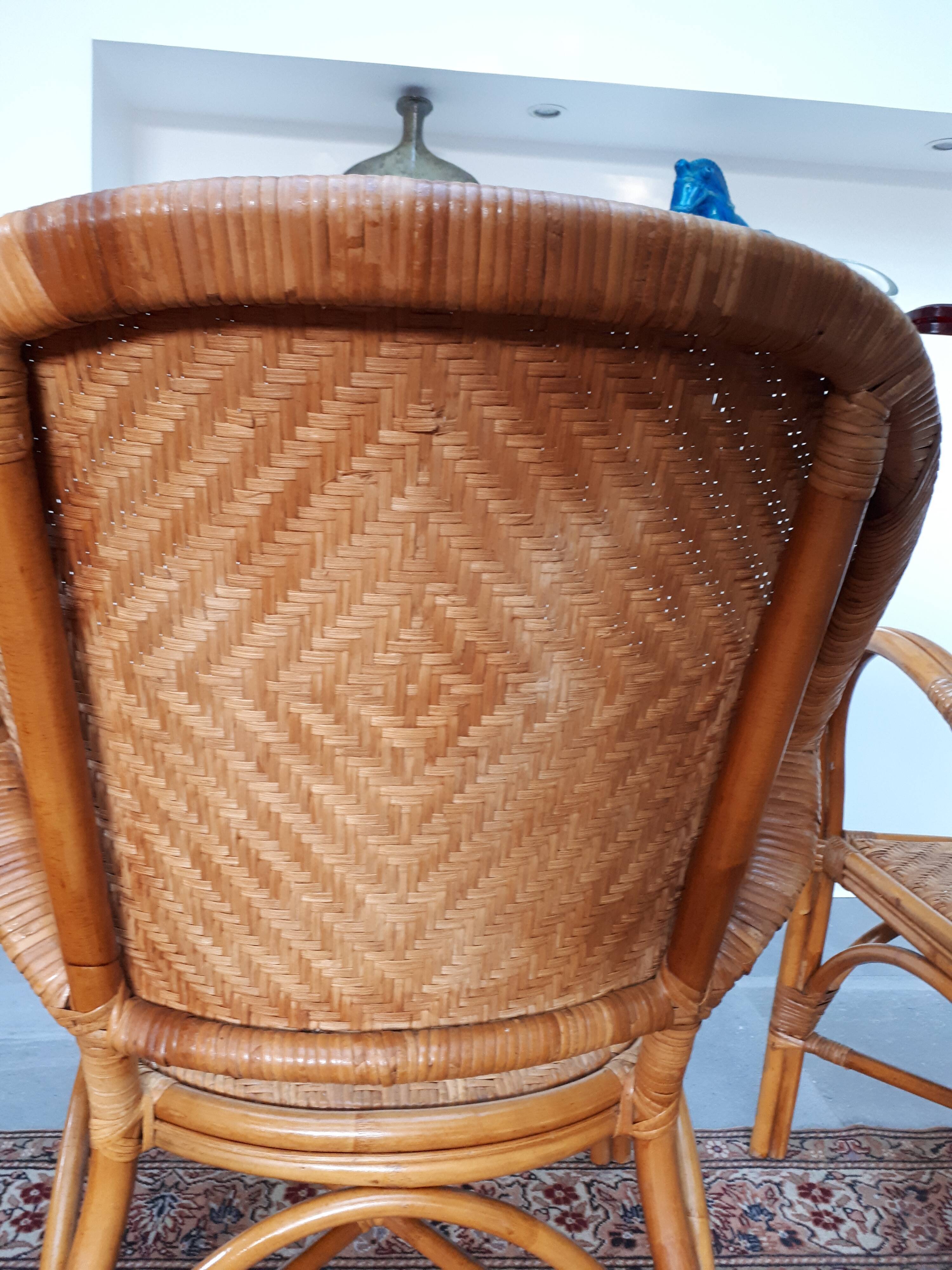 Pair of armchairs in braided rattan 70s