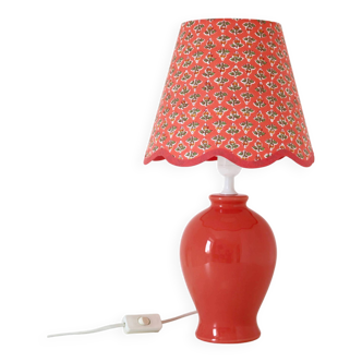 Lamp with coral pink ceramic base and printed “scalloped” lampshade